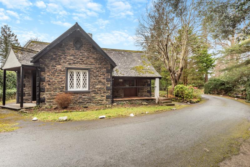 The stone-built Guest Lodge with its leaded windows, set in the manor grounds